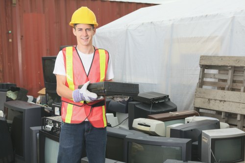 Team handling hazardous material removal during clearance