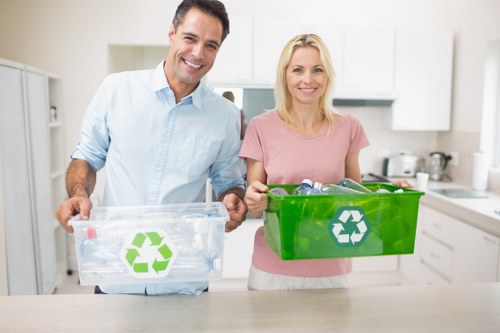 Clearance workers sorting items for recycling and donation